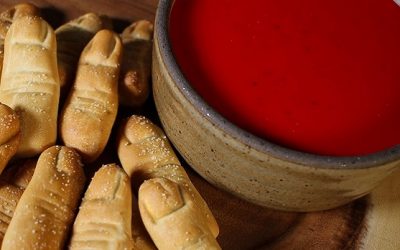Try your hand at these “Severed Soft Pretzel Fingers with Bloody Beer Cheese Sauce”