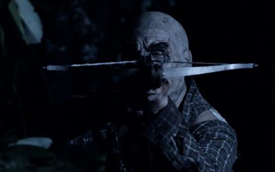 Exclusive trailer and art: There’s someone very nasty lurking “BETWEEN THE TREES”