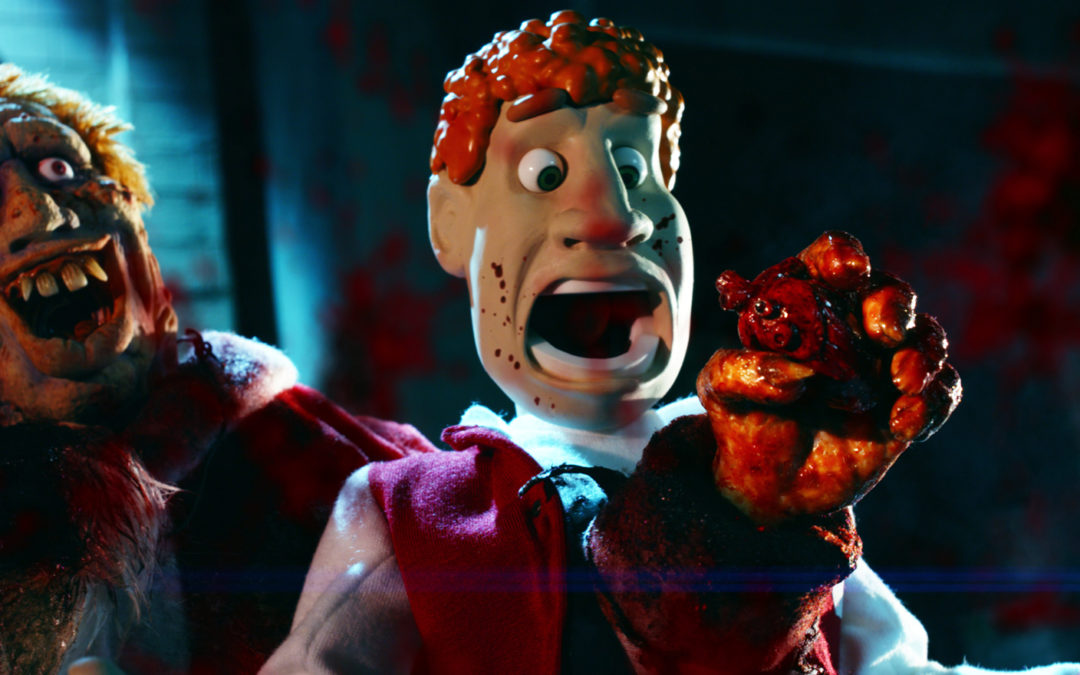 Awesome Saxon music video released for outrageous puppet gorefest “CHUCK STEEL: NIGHT OF THE TRAMPIRES”