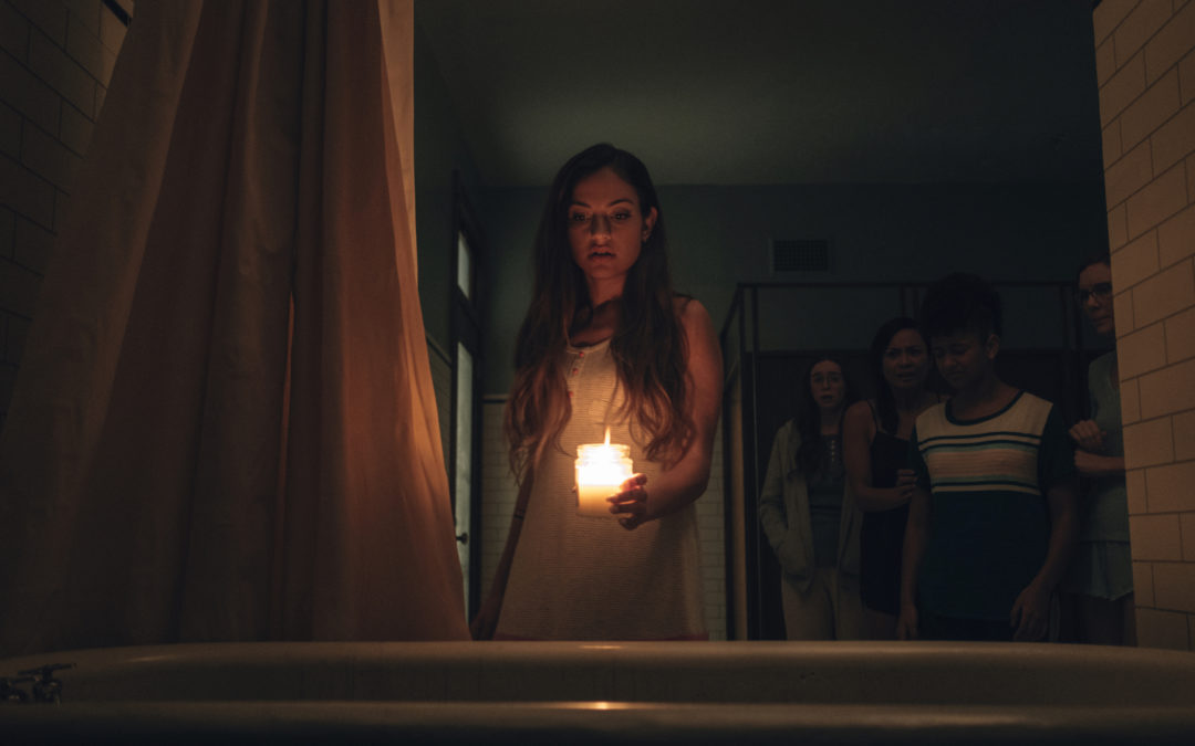 New poster for Simon Barrett’s “SEANCE” has horror in hand