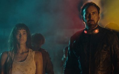Nicolas Cage stands tall on the new “PRISONERS OF THE GHOSTLAND” poster