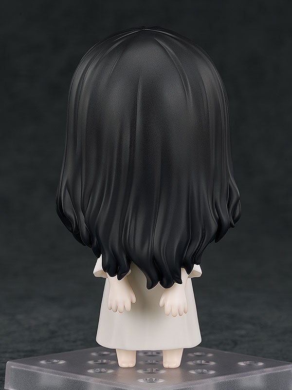 Official product photo of the Nendoroid Sadako figure from Ringu, with her well and TV backdrop